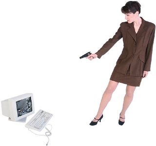 Woman professional standing with computer shooting gun uid